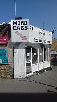 Mini cab office Sydenham station south london uk.