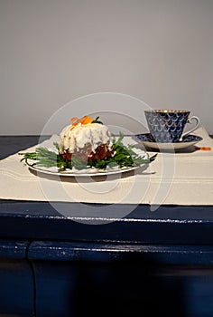 Mini carrot cake with cream cheese icing and a cup of tea