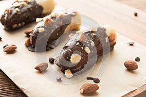Mini chocolate covered frozen bananas with almonds