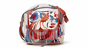 A mini crossbody bag in a bold eyecatching print adorned with tassels and fringe for a playful touch photo