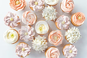 Mini cupcakes decorated with buttercream flowers.