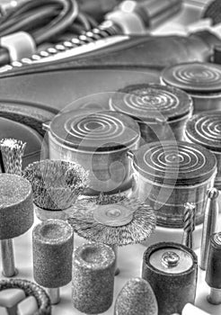 Mini drill machine with set of different accessories in black and white