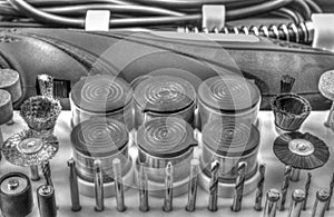 Mini drill machine with set of different accessories in black and white