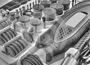 Mini drill machine with set of different accessories in black and white