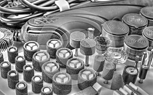 Mini drill machine with set of different accessories in black and white