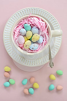 Mini Easter eggs in cup in vertical format