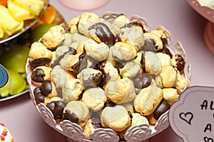 Mini eclairs with chocolate