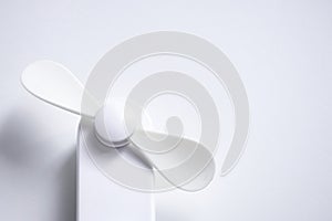 Mini electric fan with handle  on white background
