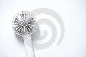 Mini electric fan with handle  on white background