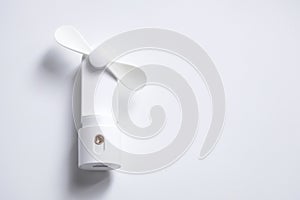 Mini electric fan with handle isolated on white background