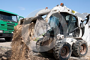 Mini excavator at construction site