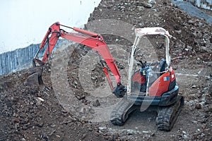 Mini excavator on a construction site
