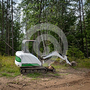 Mini excavator machine at a new home construction site