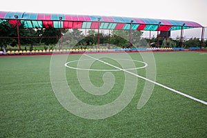 Mini Football Goal On An Artificial Grass . Inside of indoor football field . Mini football stadium center