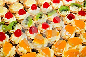 Mini fruit tarts with various fruit photo