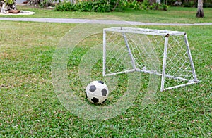 mini goal futsal court with soccer ball on the grass at outdoor park