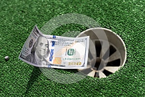 Mini Golf club, money on the artificial grass