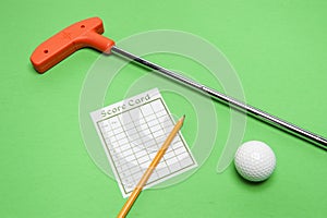 Mini Golf club with score card, ball and pencil