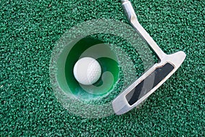 Mini golf scene with ball and club