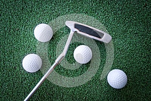 Mini golf scene with ball and club photo