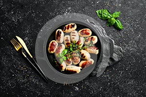 Mini grilled sausages on a frying pan. Barbecue. Meat menu.