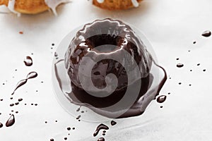 mini gugelhupf with chocolate icing.