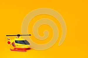 mini heli toy with orange background