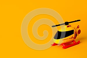 mini heli toy with orange background