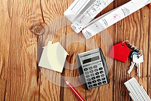 Mini House, Sketch, Keys and Calculator on Table