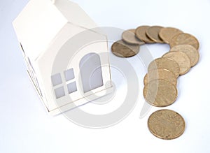 Mini house on stack of coins. Concept of Investment property. Housing on credit