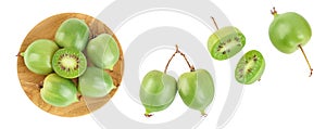 mini kiwi baby fruit or actinidia arguta in wooden bowl isolated on white background with full depth of field. Top view