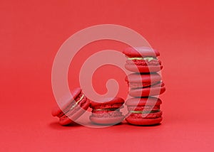 Mini macaroon cookie stack on red bakcgrounds
