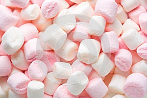 Mini marshmallows of white and light pink colors. Selective Focus. Top view