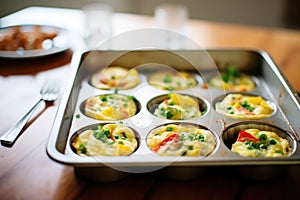 mini omelettes in muffin tin, out of the oven