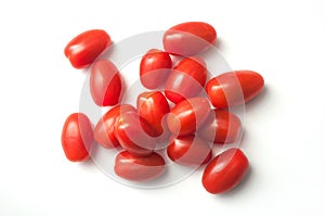 mini organic tomatoes roma on white background