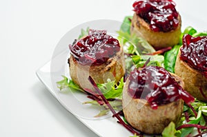 Mini pork pies, seasoned British pork, wrapped in crisp, flavoursome pastry served with  beetroot and orange chutney on topl