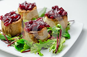 Mini pork pies, seasoned British pork, wrapped in crisp, flavoursome pastry served with  beetroot and orange chutney on topl