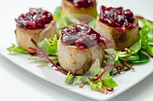 Mini pork pies, seasoned British pork, wrapped in crisp, flavoursome pastry served with  beetroot and orange chutney on topl