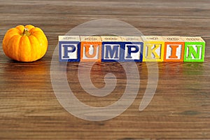 Mini pumpkin with word pumpkin