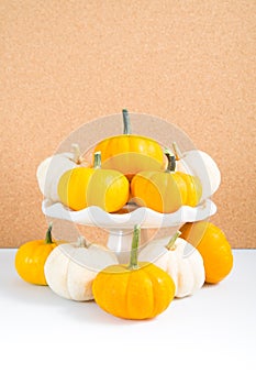 Mini pumpkins on cork background