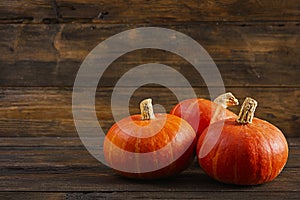 Mini pumpkins on wooden background. Thanksgiving day concept