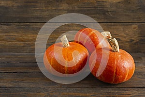 Mini pumpkins on wooden background. Thanksgiving day concept