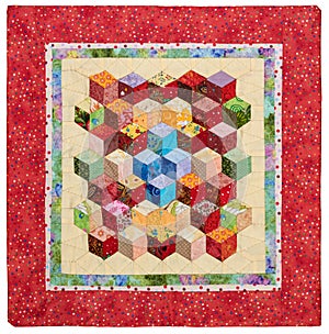 Mini quilt sewn from diamonds and has view three-dimensional