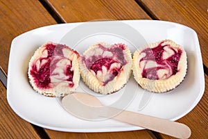 Mini raspberry cheesecakes in muffin forms