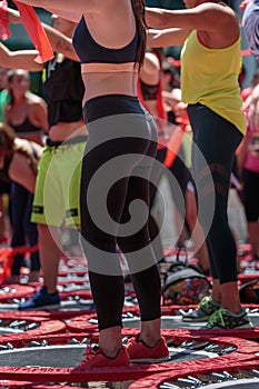 Mini Rebounder Workout: Girls doing Fitness Exercise in Outdoor Class at Gym