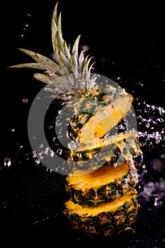 Fresh pineapple in splash water