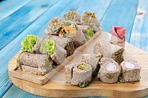 Mini Rolls using Toast Sandwiches, Mixed Toast Rolls on Blue Wood Surface - Mini Mixed Pastries for Catering