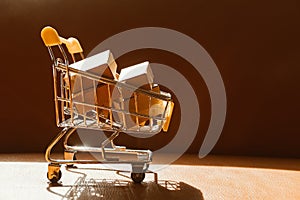 Mini shopping cart contain paper box using as e-commerce, online