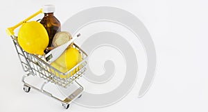 Mini shopping cart full of medicines for flu and colds