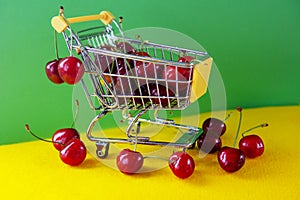 Mini shoppingcart with red ripe cherri